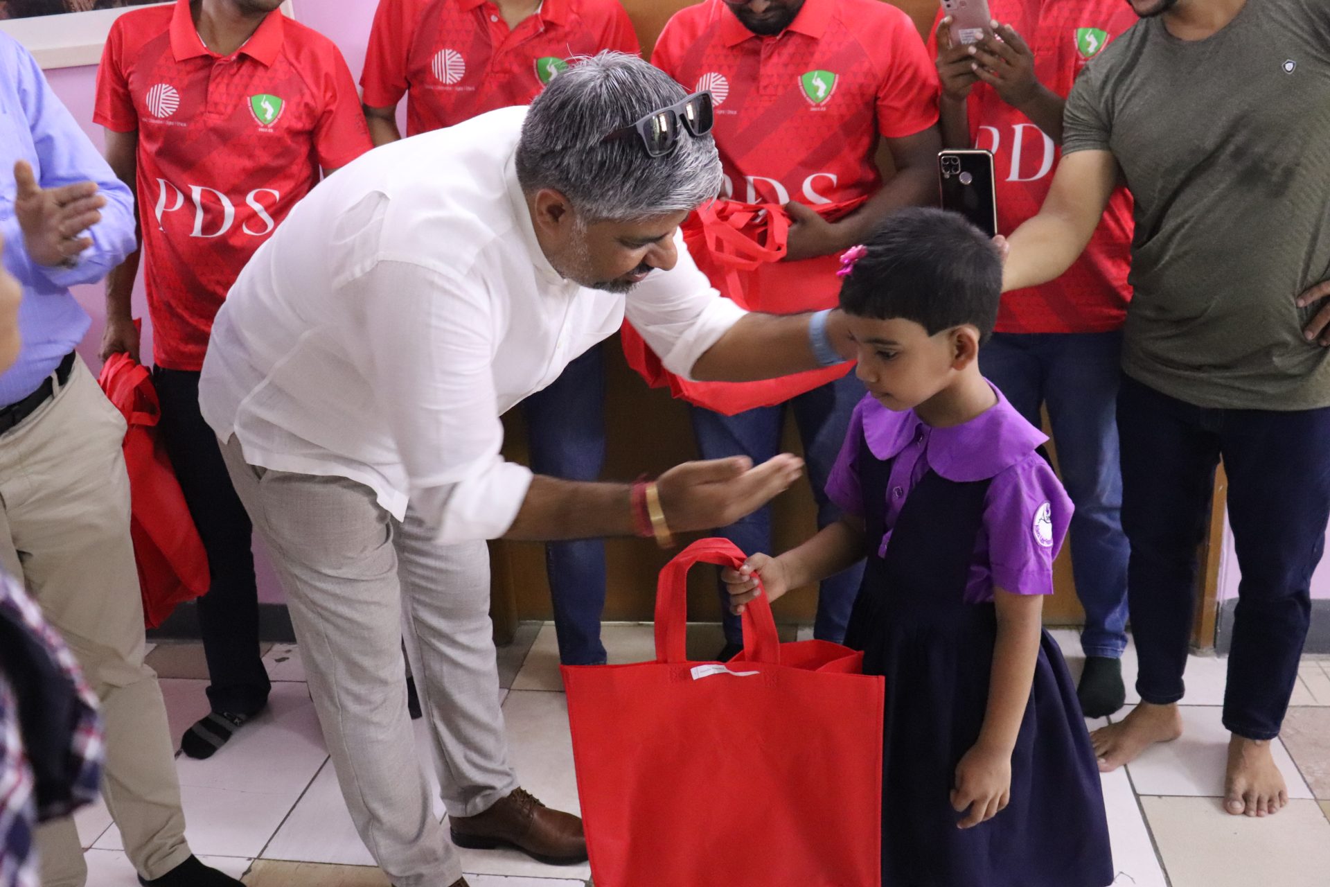 PoeticGem’s distribution of Eid clothes for all students and school team members